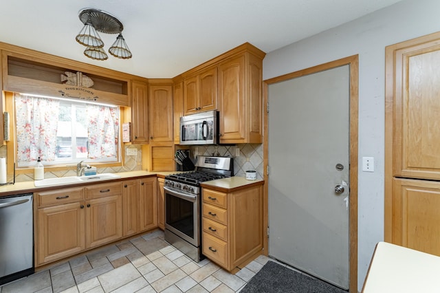 510 24th St SW, Rochester, MN 55902 - kitchen featuring stainless steel appliances, decorative backsplash, light countertops, and open shelves