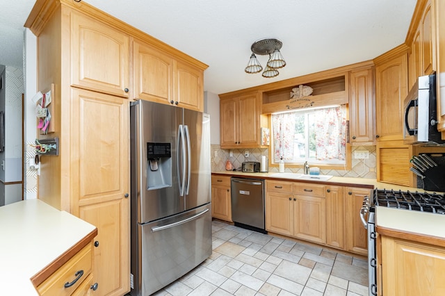 510 24th St SW, Rochester, MN 55902 - kitchen featuring stainless steel appliances, tasteful backsplash, light countertops, light brown cabinets, and open shelves
