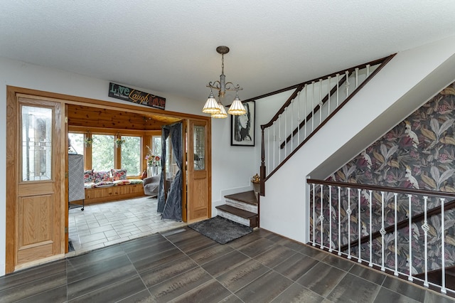 510 24th St SW, Rochester, MN 55902 - foyer entrance featuring stairway, a chandelier, and a textured ceiling