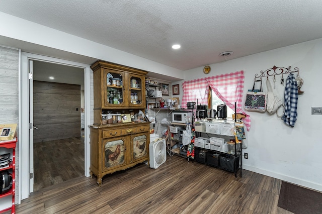 510 24th St SW, Rochester, MN 55902 - misc room with dark wood finished floors, a textured ceiling, and recessed lighting