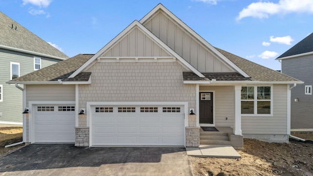 10180 Shadyview Ln N, Maple Grove, MN 55311 - view of front of home featuring board and batten siding, asphalt driveway, and a shingled roof