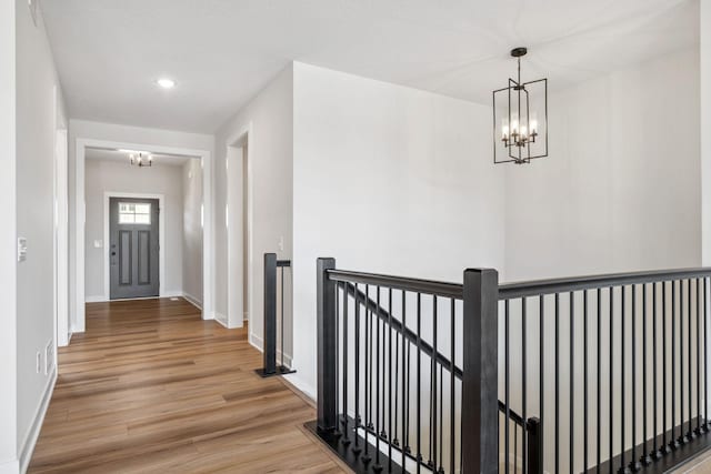 10180 Shadyview Ln N, Maple Grove, MN 55311 - hallway featuring a chandelier, an upstairs landing, light wood-style floors, and recessed lighting