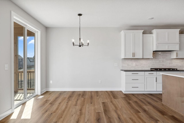 10180 Shadyview Ln N, Maple Grove, MN 55311 - kitchen with plenty of natural light, a chandelier, and wood finished floors