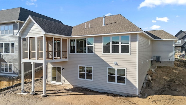 10180 Shadyview Ln N, Maple Grove, MN 55311 - back of house featuring a sunroom and a shingled roof