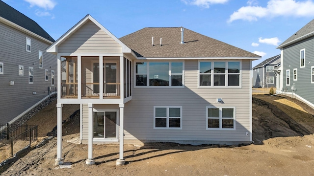 10180 Shadyview Ln N, Maple Grove, MN 55311 - back of property with a sunroom and a shingled roof