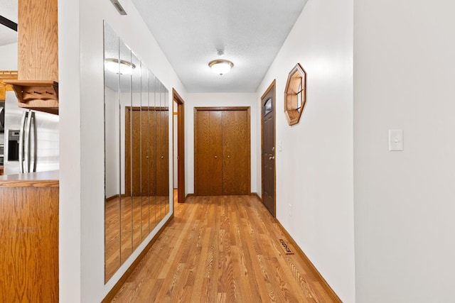 17865 Fillmore St NE, Ham Lake, MN 55304 - hallway featuring light wood-style flooring