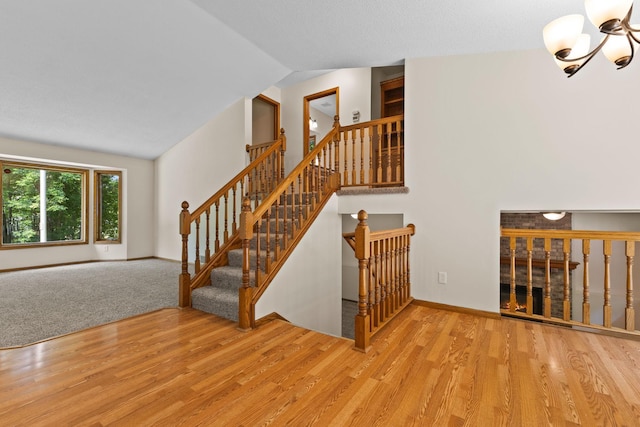 17865 Fillmore St NE, Ham Lake, MN 55304 - staircase with lofted ceiling and wood finished floors
