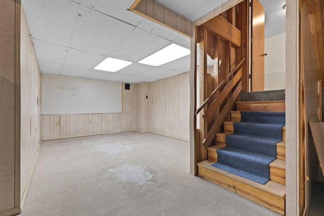 17865 Fillmore St NE, Ham Lake, MN 55304 - finished basement with wooden walls, stairs, and a drop ceiling