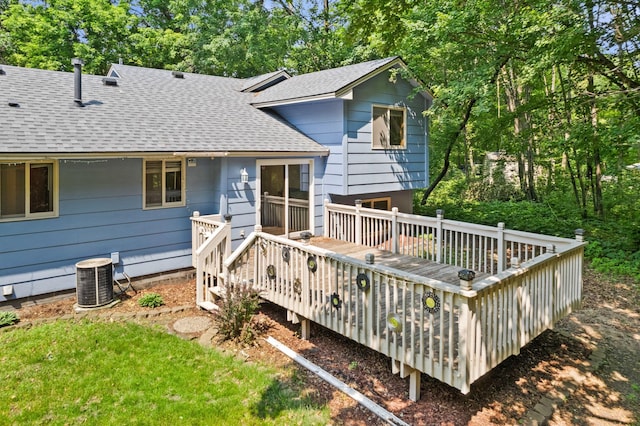 17865 Fillmore St NE, Ham Lake, MN 55304 - rear view of property with roof with shingles, a wooden deck, and view of scattered trees