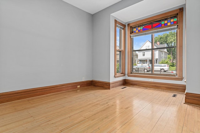 1813 11th Ave S, Minneapolis, MN 55404 - unfurnished room featuring hardwood / wood-style floors