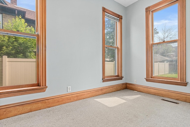 1813 11th Ave S, Minneapolis, MN 55404 - unfurnished room featuring carpet floors and baseboards