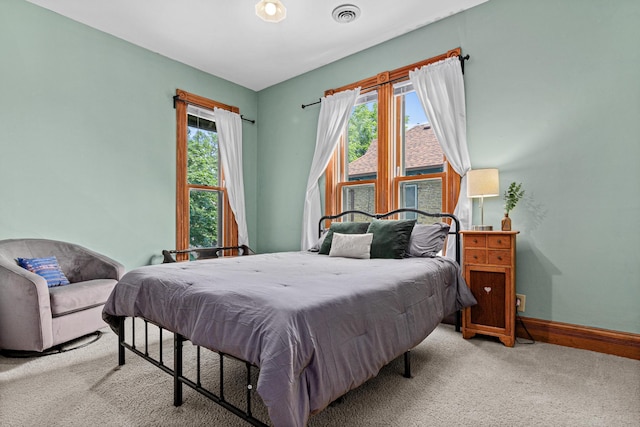 1813 11th Ave S, Minneapolis, MN 55404 - carpeted bedroom featuring multiple windows