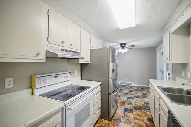 455 Sylvan St, Owatonna, MN 55060 - kitchen with white range with electric stovetop, under cabinet range hood, dishwasher, dark stone finish floors, and light countertops