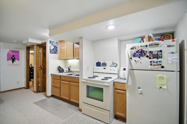 455 Sylvan St, Owatonna, MN 55060 - kitchen with white appliances, light countertops, and light colored carpet