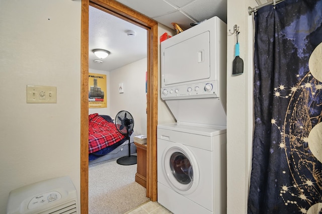 455 Sylvan St, Owatonna, MN 55060 - laundry area with stacked washing machine and dryer and carpet flooring