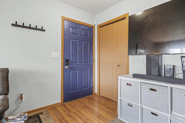 3034 18th St S, Fargo, ND 58103 - foyer entrance featuring light wood finished floors and a textured ceiling