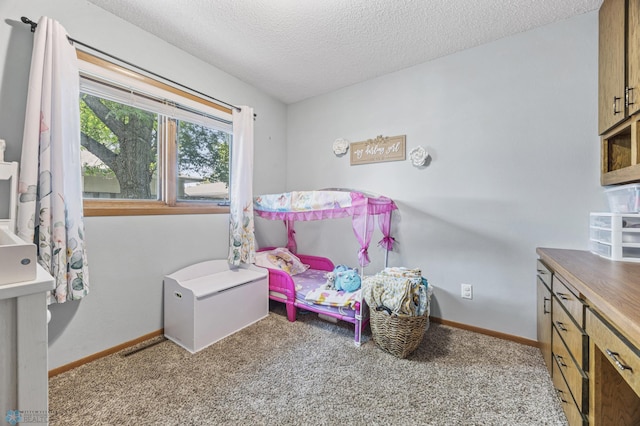 3034 18th St S, Fargo, ND 58103 - bedroom with a textured ceiling and carpet