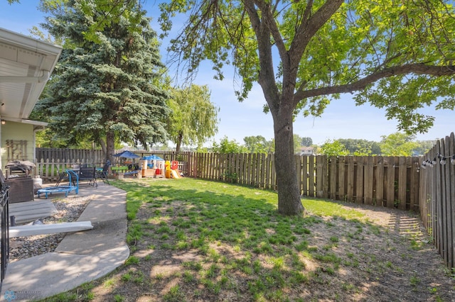 3034 18th St S, Fargo, ND 58103 - fenced backyard with a playground and a patio