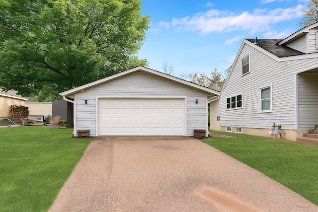 1115 3rd St NW, Faribault, MN 55021 - view of front of property featuring an outbuilding, a front lawn, and a detached garage