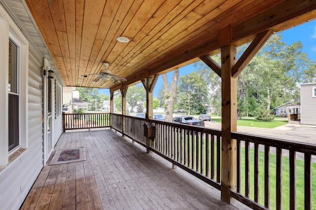 1115 3rd St NW, Faribault, MN 55021 - porch with a ceiling fan, view of scattered trees, and a lawn