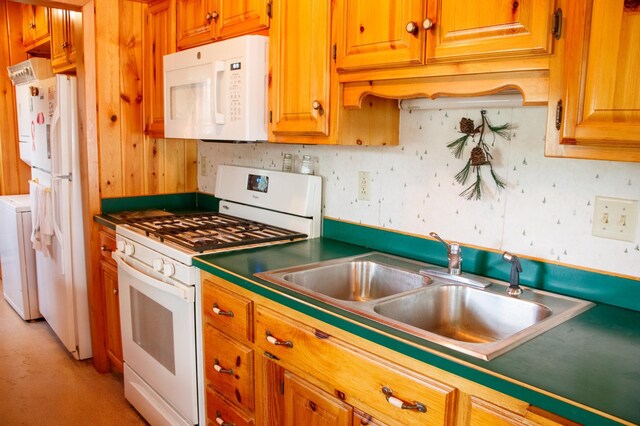 29042 County Road 4, Breezy Point, MN 56472 - kitchen featuring white appliances, brown cabinetry, and washer / dryer