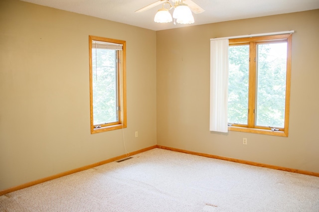 29042 County Road 4, Breezy Point, MN 56472 - unfurnished room with plenty of natural light, carpet flooring, and a ceiling fan