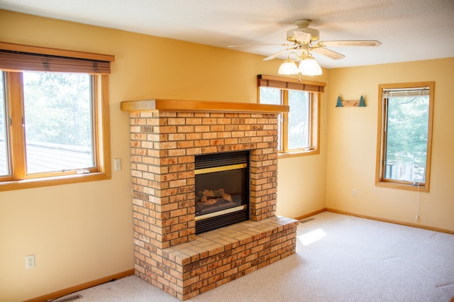 29042 County Road 4, Breezy Point, MN 56472 - unfurnished living room featuring carpet floors, a brick fireplace, plenty of natural light, and a ceiling fan