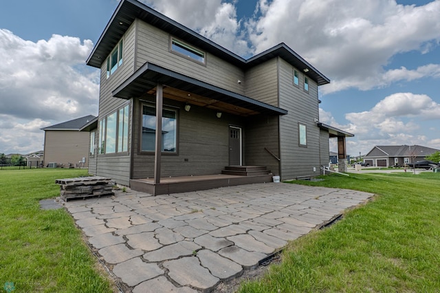 3405 4th St E, West Fargo, ND 58078 - rear view of house featuring a patio and a yard