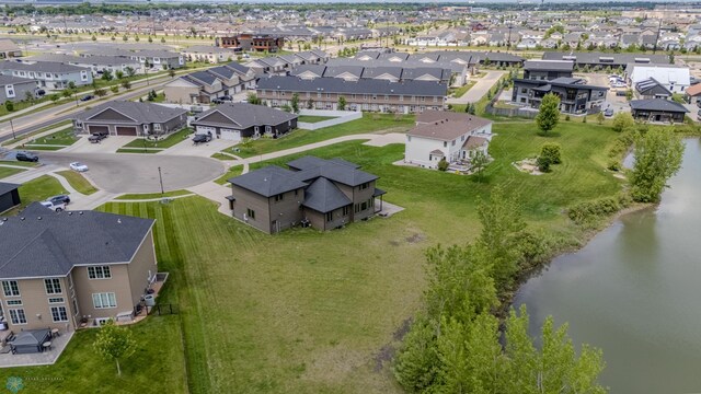 3405 4th St E, West Fargo, ND 58078 - aerial view of property and surrounding area with a large body of water and nearby suburban area