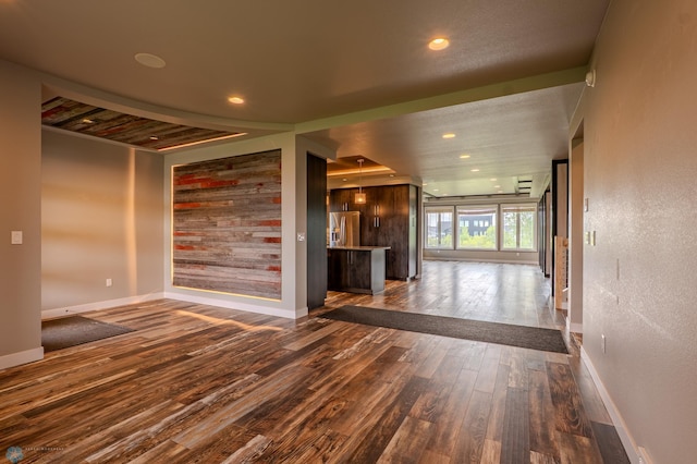 3405 4th St E, West Fargo, ND 58078 - unfurnished living room with dark wood-style flooring and recessed lighting