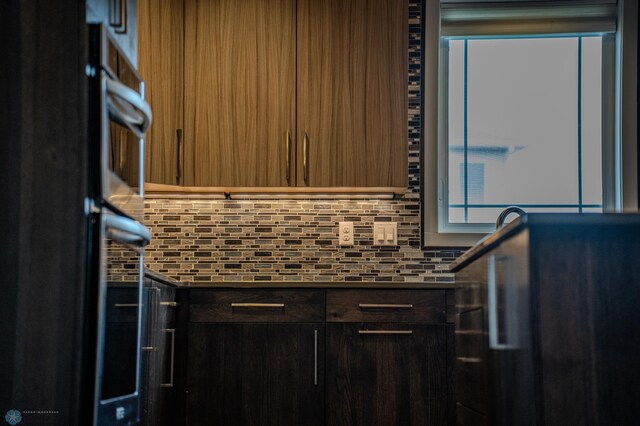 3405 4th St E, West Fargo, ND 58078 - kitchen featuring backsplash, modern cabinets, and double oven