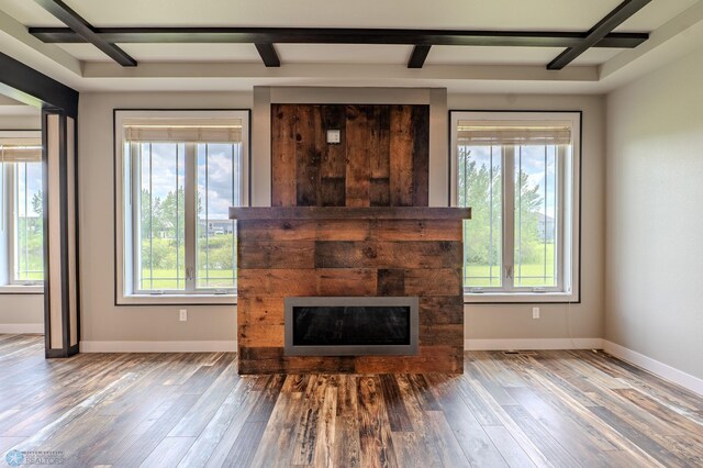 3405 4th St E, West Fargo, ND 58078 - living area with a tile fireplace, healthy amount of natural light, wood finished floors, coffered ceiling, and beam ceiling
