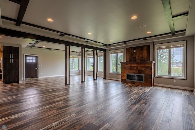 3405 4th St E, West Fargo, ND 58078 - unfurnished living room with dark wood-style floors, a glass covered fireplace, and recessed lighting
