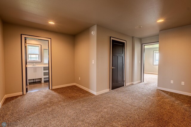 3405 4th St E, West Fargo, ND 58078 - carpeted spare room with baseboards and recessed lighting