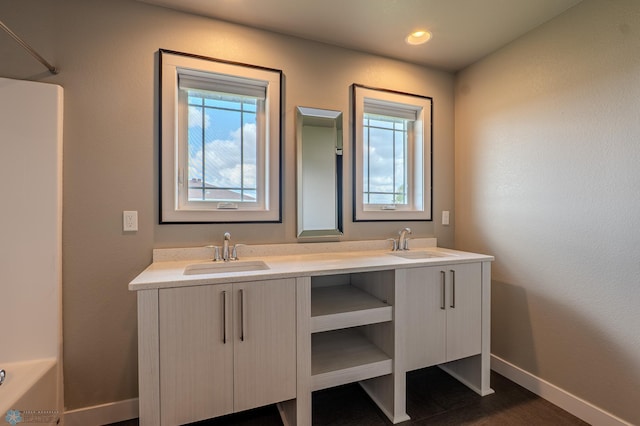 3405 4th St E, West Fargo, ND 58078 - full bathroom featuring double vanity and wood finished floors