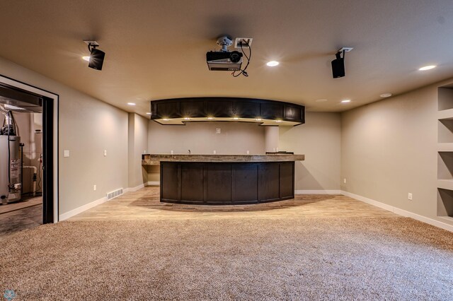 3405 4th St E, West Fargo, ND 58078 - home theater featuring light carpet, bar with sink, water heater, and recessed lighting
