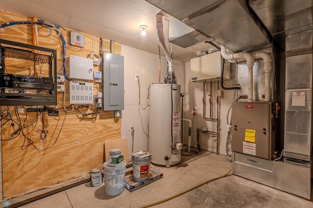 3405 4th St E, West Fargo, ND 58078 - utility room featuring electric panel, water heater, and heating unit