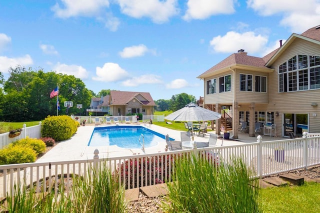 13907 Washington St NE, Ham Lake, MN 55304 - view of swimming pool featuring a patio and a fenced backyard