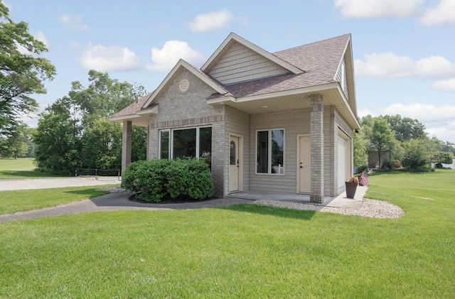 13907 Washington St NE, Ham Lake, MN 55304 - view of front of property featuring roof with shingles, brick siding, and a front lawn