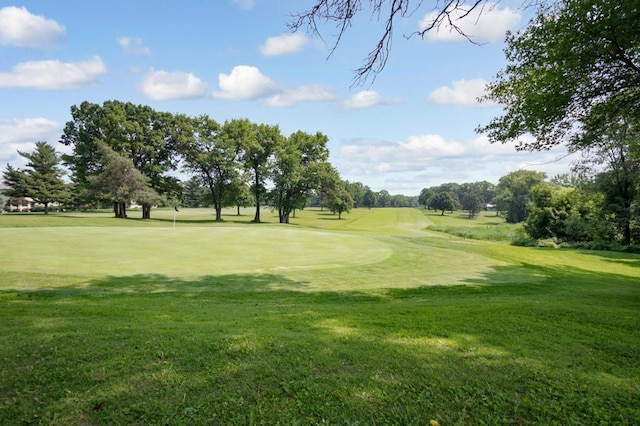 13907 Washington St NE, Ham Lake, MN 55304 - view of community with a yard and view of golf course