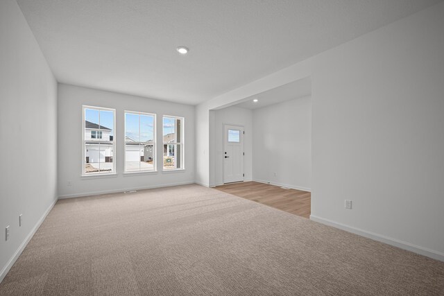 11532 Polaris Ln N, Dayton, MN 55369 - spare room with light carpet and recessed lighting