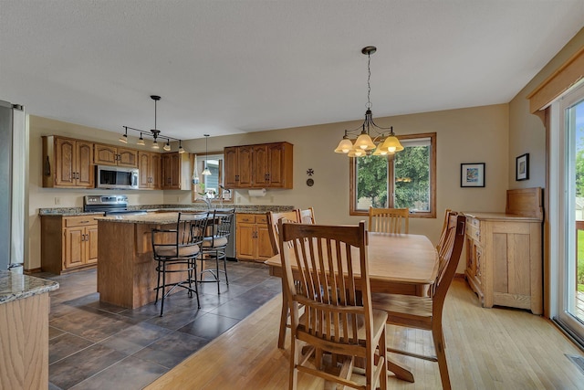 2708 Tranquility Dr, Saint Cloud, MN 56301 - dining area with plenty of natural light and a chandelier