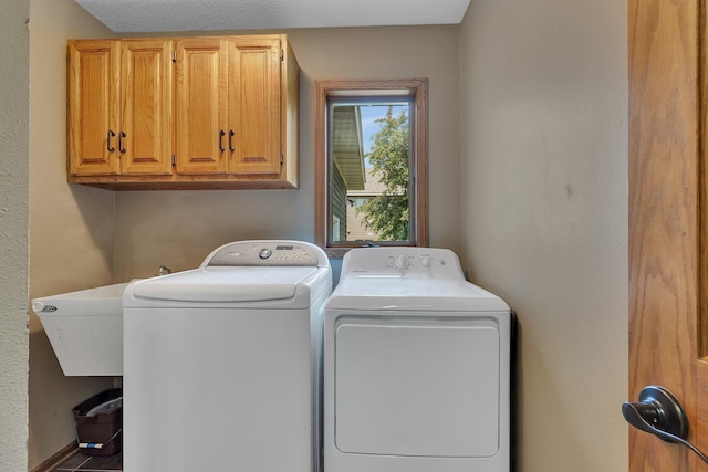 2708 Tranquility Dr, Saint Cloud, MN 56301 - washroom featuring washing machine and dryer and cabinet space
