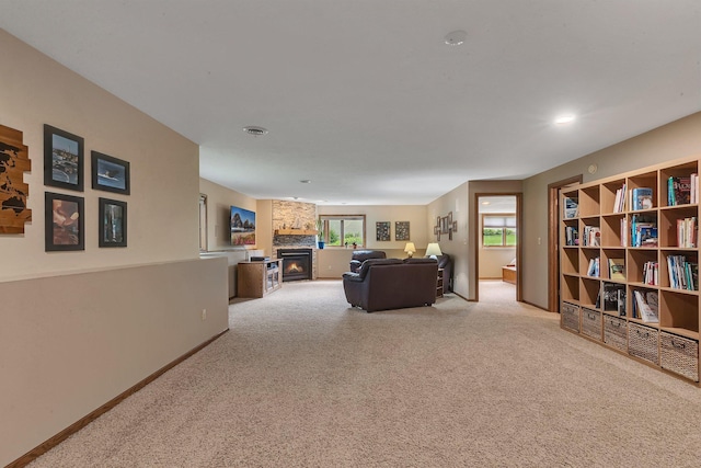 2708 Tranquility Dr, Saint Cloud, MN 56301 - living room with carpet floors, a stone fireplace, and baseboards