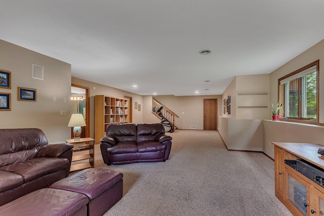 2708 Tranquility Dr, Saint Cloud, MN 56301 - living room with light colored carpet, stairs, and recessed lighting