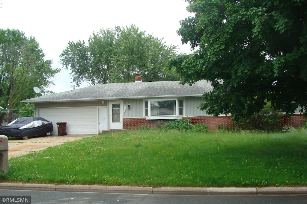 3445 Lester Ave, Hastings, MN 55033 - single story home with an attached garage, brick siding, concrete driveway, a front yard, and roof with shingles