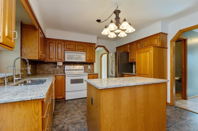 14500 Raleigh Ave, Savage, MN 55378 - kitchen with white appliances, a chandelier, decorative backsplash, a center island, and light stone countertops
