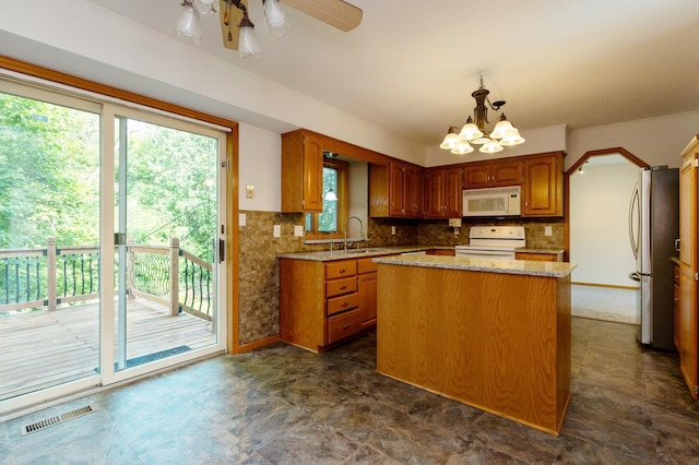 14500 Raleigh Ave, Savage, MN 55378 - kitchen with white appliances, plenty of natural light, and a center island