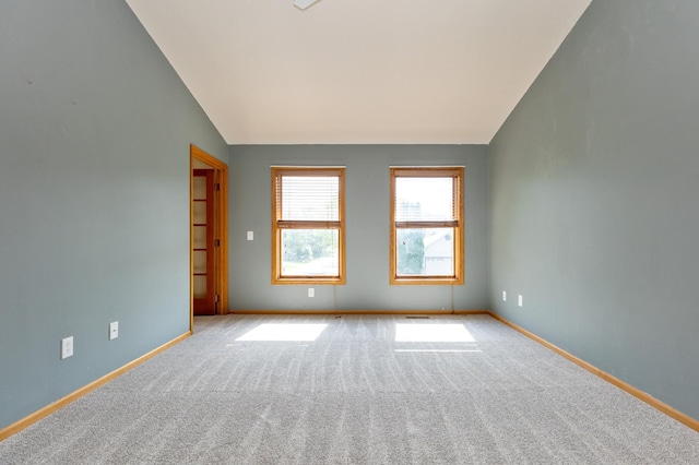 14500 Raleigh Ave, Savage, MN 55378 - carpeted empty room with vaulted ceiling and baseboards
