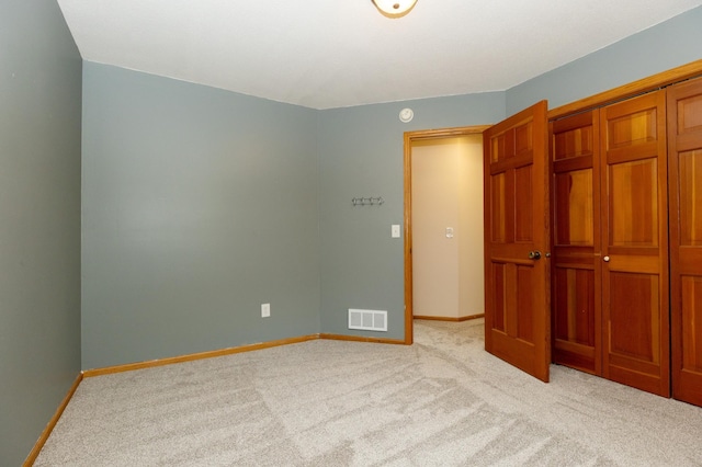 14500 Raleigh Ave, Savage, MN 55378 - unfurnished bedroom featuring light carpet and a closet